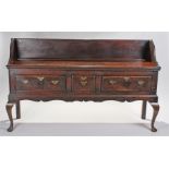 18th Century oak dresser base, circa 1740, the long rectangular top with later high gallery back,