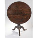 George III provincial oak bird cage action occasional table. The plank circular top above a bird