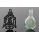 Medieval pilgrim's badge with original glass holy water bottle. Found together in Dedham, Essex. The