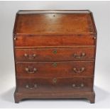 Early 18th Century oak bureau, of deep proportions. The rectangular top with a deep fall enclosing