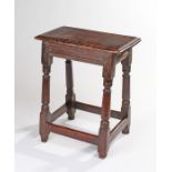 Mid 17th Century oak joint stool, circa 1650-1680, the rectangular top with moulded edge above grove