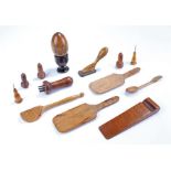 Mixed treen, to include an egg and stand, needle cases, a door jam, reeded spatulas, etc (qty)