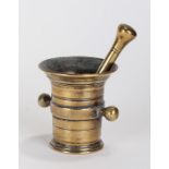 18th Century brass pestle and mortar, the turned pestle of standard form, together with a ring