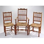 Set of six 19th Century Lancashire dining chairs, circa 1800-1860, with an undulating top rail,