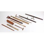 Collection of treen, to include a club, a paddle, two beams, a large pair of tongs, etc (qty)