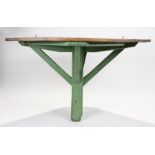 19th Century pine corner orangery table, the curved pine plank top above green painted base with