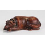 Charming George III mahogany dog snuff box, the reclining dog with a copper collar, the base