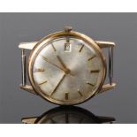 Gentleman's 9 carat gold wristwatch, the unsigned silvered dial with baton hours and date