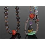 Unusual Chinese smoky quartz and jade necklace, of large proportions, the carved spheres of smoky