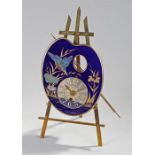 Early 20th Century brass and porcelain easel clock, the dial in the form of an artist pallet,