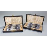 Two cased sets of mid 20th Century Danish silver dessert spoons and forks, maker W & S. Sorensen-