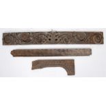 18th Century elongated oak panel with applied decoration and floral rosettes, 120cm long, together