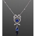 Fine Art Deco sapphire and diamond necklace. The pear sapphire below a ribbon tied border and