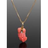 18 carat gold coral and diamond pendant necklace, the oriental carved coral head with diamond