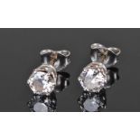 Pair of diamond ear studs, the diamonds at approximately 0.45 carats each set on silver