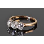 18 carat gold diamond ring set with three diamonds, the central diamond approximately 0.30 carats,