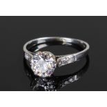 Art Deco platinum and diamond set ring, the central diamond at approximately 1.2 carats with six