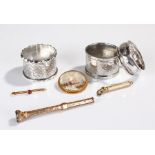 Gold plated propelling pencil, together with two silver napkin rings, a pewter napkin ring, two