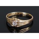 18 carat gold diamond set ring, the single diamond on a high shank, ring size O 1/2