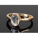 18 carat gold aquamarine set ring. The pale aquamarine oval stone set with an 18 carat gold shank,