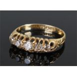 18 carat gold diamond set ring, with a row of five diamonds on a tapering shank, ring size S