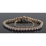 9 carat gold diamond set bracelet, set with forty two diamonds, 17.5cm long