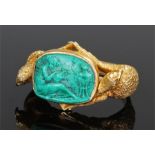 Fine 18 carat gold and malachite ring, the malachite carved plaque depicting a classical scene of