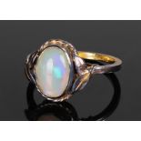 Yellow metal opal set ring, the central opal with leaf shoulders, ring size Q 1/2