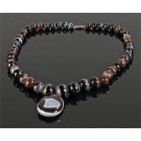 Banded agate necklace with graduating balls and an oval banded agate pendant drop, 61cm long