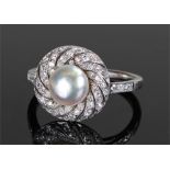 White metal natural pearl and diamond set ring, the central pearl at 1.94 carats, diamonds to the