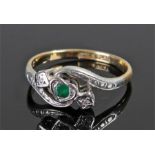 18 carat gold emerald and diamond ring, with a central emerald and diamond cross over, ring size N