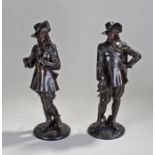 Pair of late 19th Century French bronzed spelter figures in the form of cavaliers standing with
