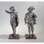 Pair of 19th Century bronzed and silver plated spelter figures of cavaliers, modelled in dramatic