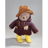 Paddington bear stuffed toy with hat jacket and boots, together with the original label Design