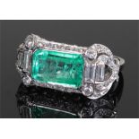 Impressive emerald and diamond set ring, the emerald cut emerald at approximately 7.50 carats,