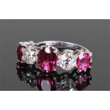 Fine ruby and diamond ring, the white metal shank with three unheated rubies at 3.01 carats in