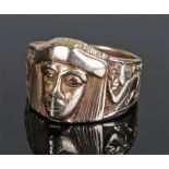 Gentleman's 9 carat gold ring, in the Egyptian style, with a Pharaohs head flanked by figures,