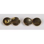 Pair of 18 carat gold and enamelled cufflinks, the circular discs with black ring enamel decoration,