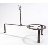 Late 18th Century wrought iron adjustable trivet with a twist beam above a three legged stand,