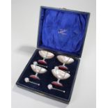Edwardian cased set of four mother of pearl and silver caviar dishes, Birmingham 1906, maker