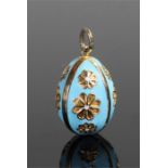 9 carat gold and enamel pendant in the form of an egg with blue enamel and flower decoration, 24mm