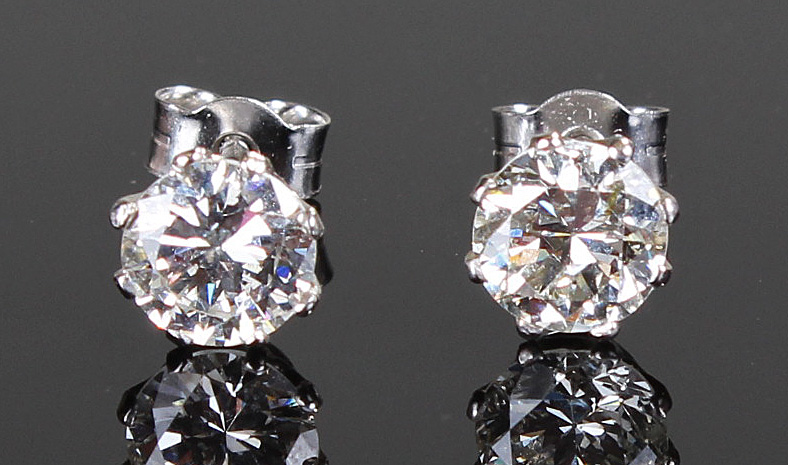 Pair of white metal diamond ear studs, at approximatley 1.68 carats in total