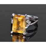 18 carat white gold citrine and diamond set ring, the central baguette citrine flanked by three