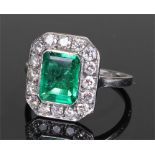 Fine Colombian emerald and diamond set ring, the white metal shank with a central, rectangular