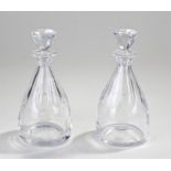 Pair of St Louis glass decanters, the faceted stopper and tapering body ending with a wide base,