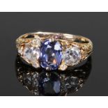 18 carat Ceylon sapphire and diamond set ring, the central unheated Ceylon sapphire at 1.95 carats