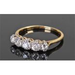 18 carat gold diamond set ring with a row of five diamonds on a platinum mount, gold shank, ring