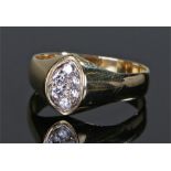 Gentleman's 18 carat gold diamond set ring, the inverted oval head in platinum with six diamonds,