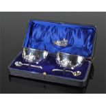 Edward VII silver pair of mustards, 1905 Birmingham, the mustards of oval form with foliate bases