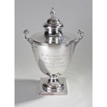 Edward VII silver trophy, Birmingham 1905, makers mark rubbed. The finial top above a shaped lid,